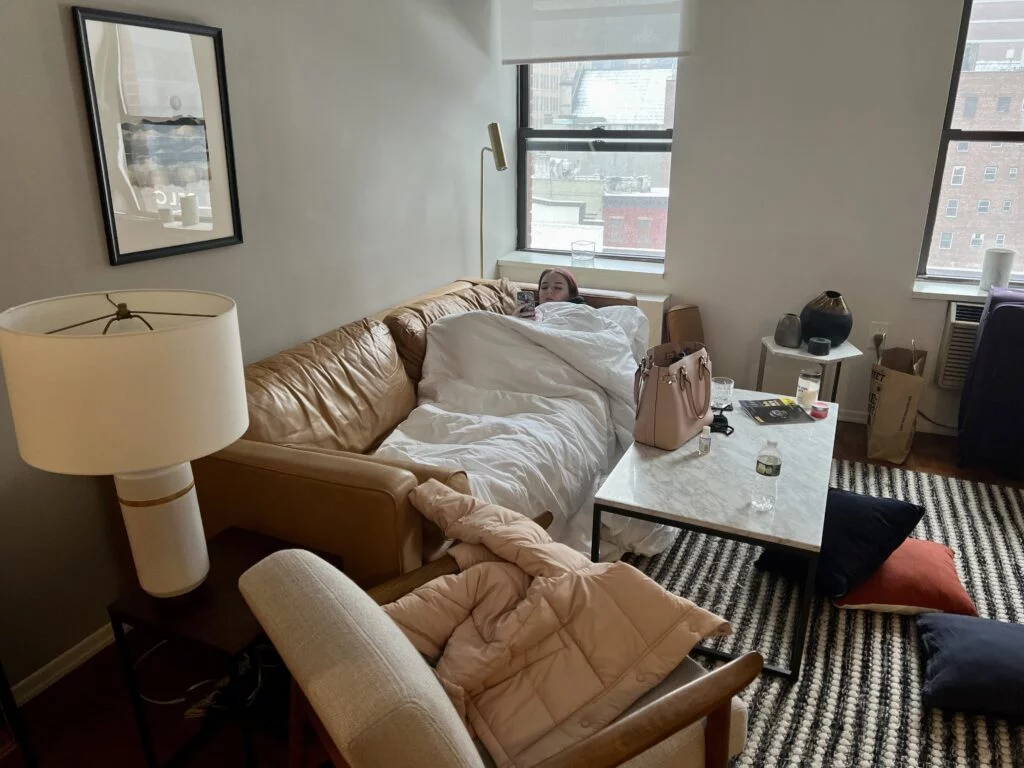 BlueGround Couch: Comfy couch in the BlueGround apartment, also used for sleeping when guests visited, adding flexibility to the space.