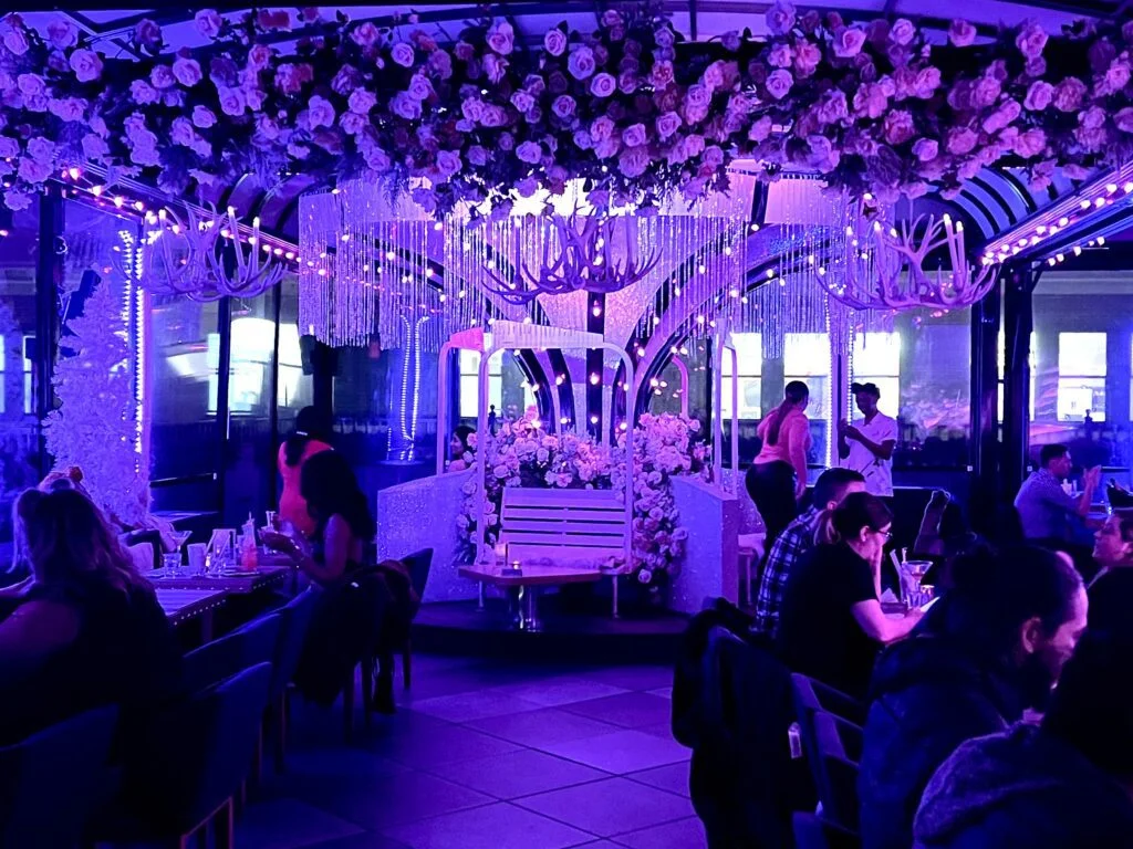 Carousel-style seating and playful decor at Magic Hour rooftop.