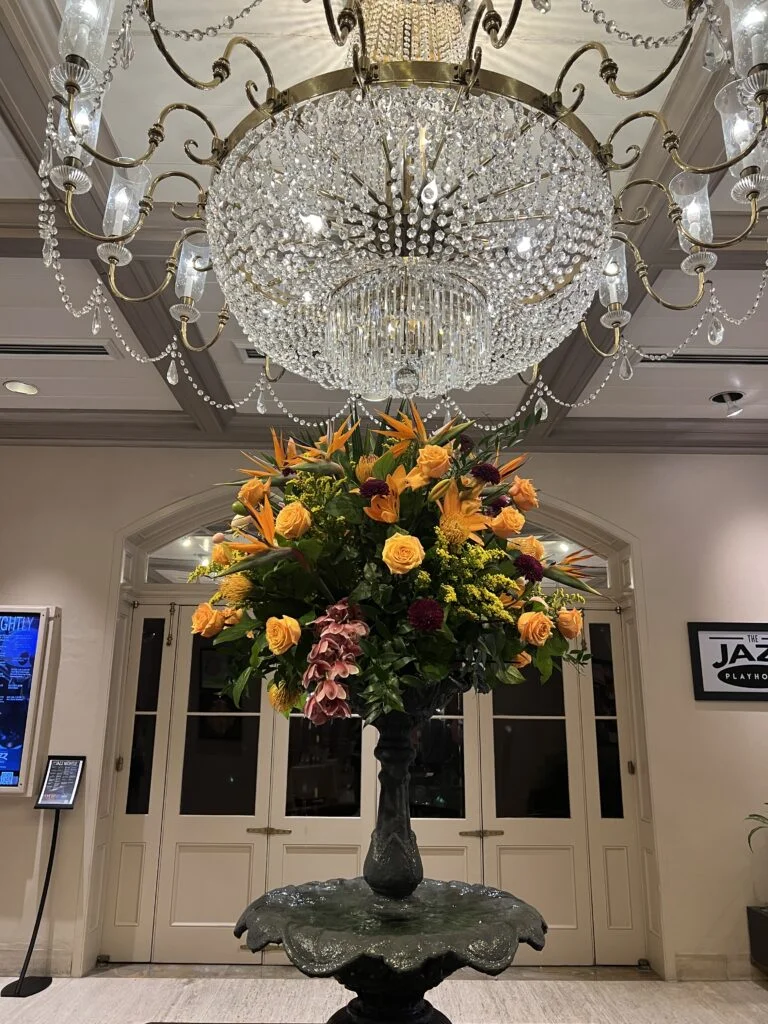 5 Days in New Orleans: A Relaxed First-Time Itinerary 1 Lobby and Chandeleir of the Royal Sonesta New Orleans with white marble floors and elegant decor