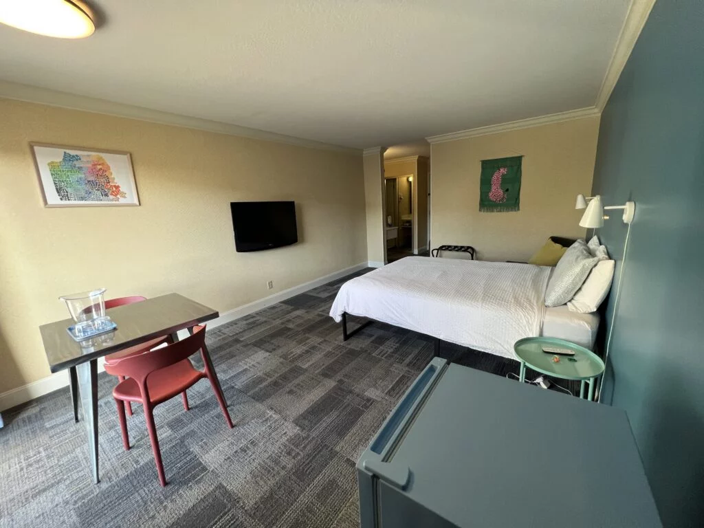 Another view of the private room showing the bed and nightstand.