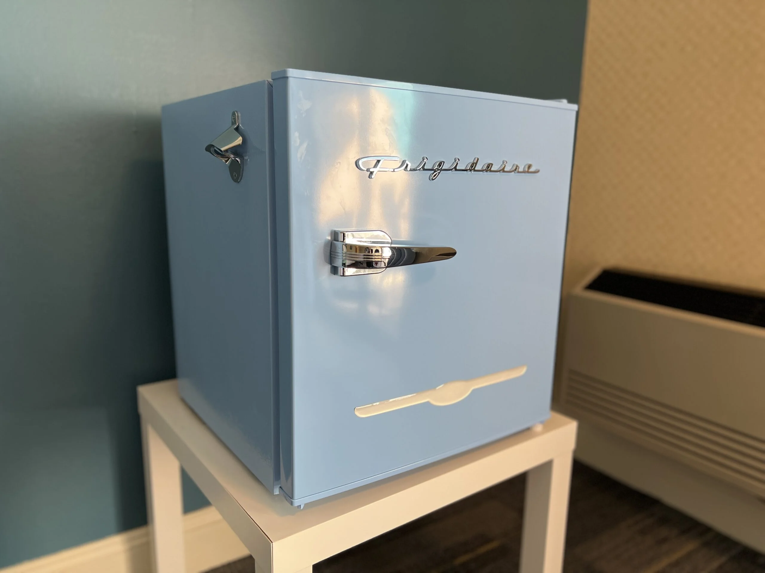A small, adorable mini-fridge in the room.
