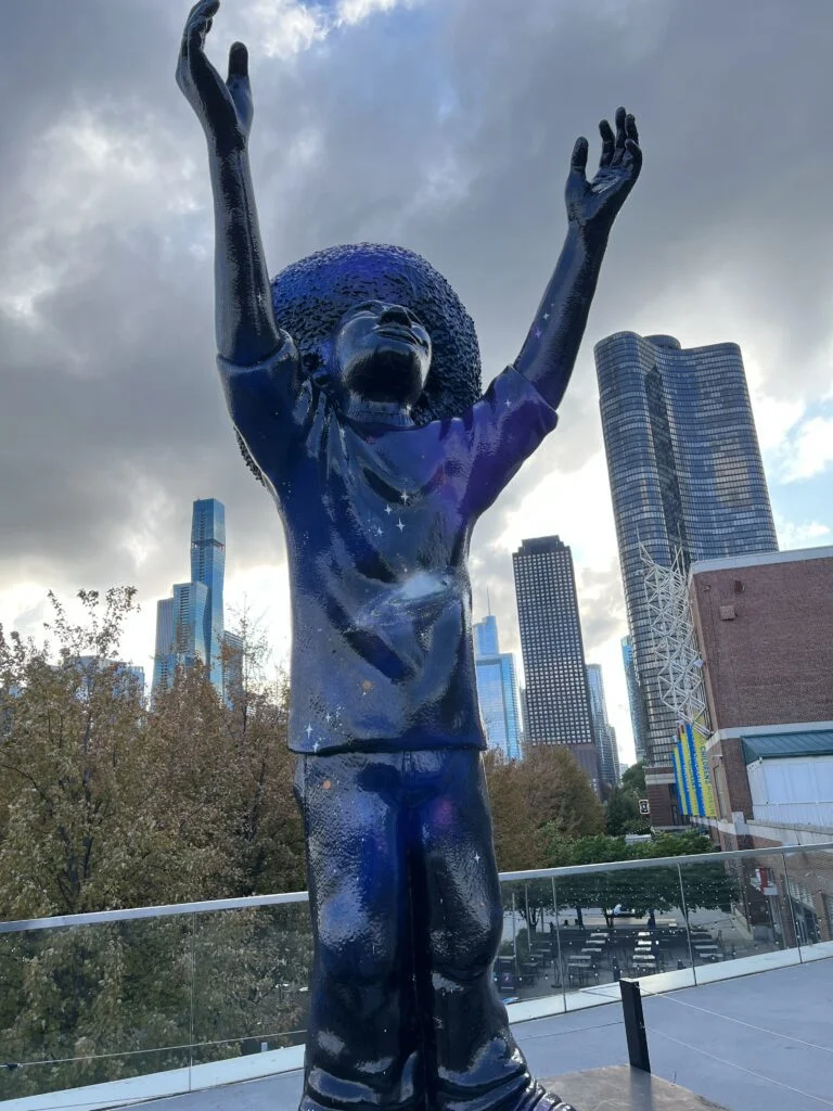"Reach" statue by artist Chris Daze Ellis