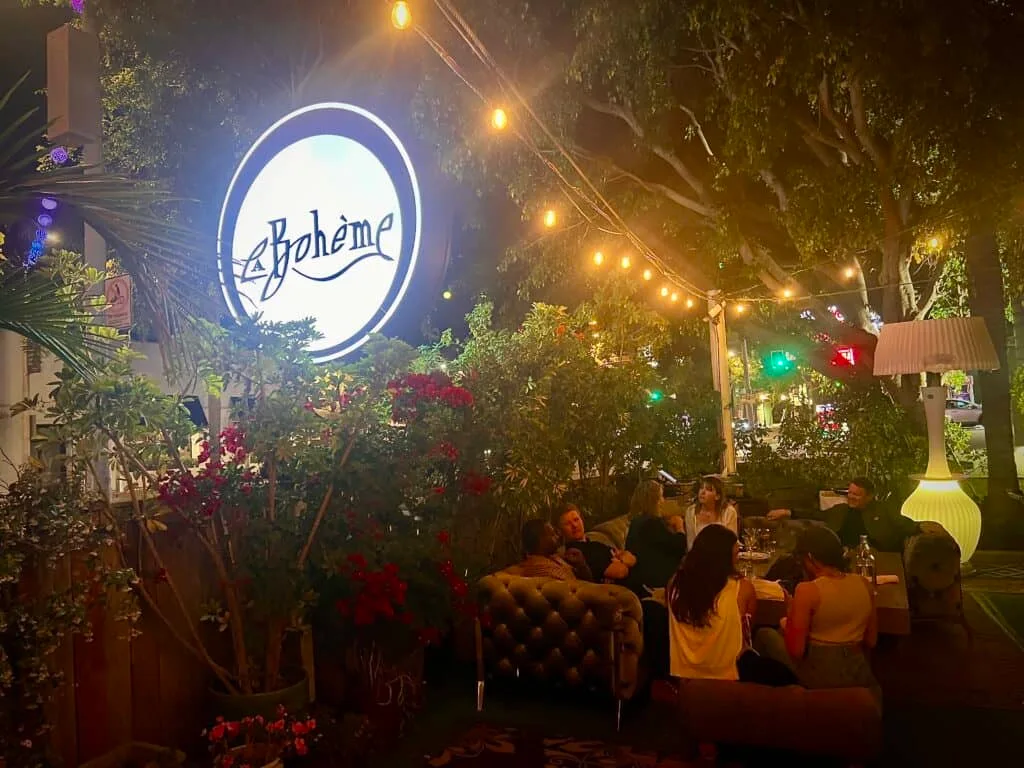 12 Fun and Unique Themed Restaurants in Los Angeles 41 La Boheme restaurant West Hollywood sign and exterior seating