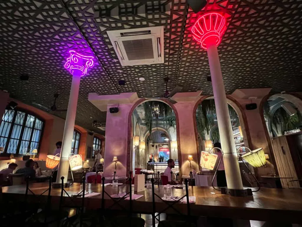 Where to Eat in Barcelona: My Honest Guide to Great Spots near the Big Sites 9 Interior of Carmina restaurant near the Picasso Museum Barcelona with colorful atmospheric lighting
