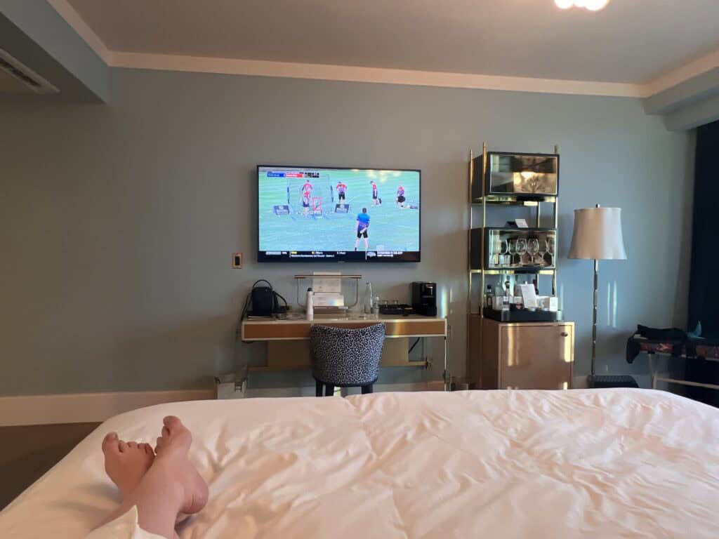 Sun Rose Hotel relaxing in bed, watching tv