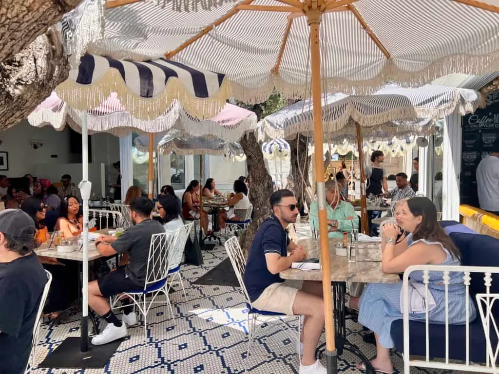 12 Fun and Unique Themed Restaurants in Los Angeles 1 outdoor patio seating at The Butcher The Baker and The Cappuccino Maker West Hollywood