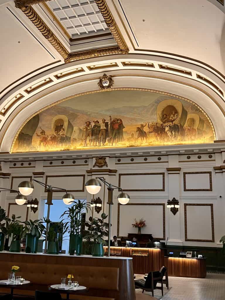Asher Adams hotel lobby pioneer mural