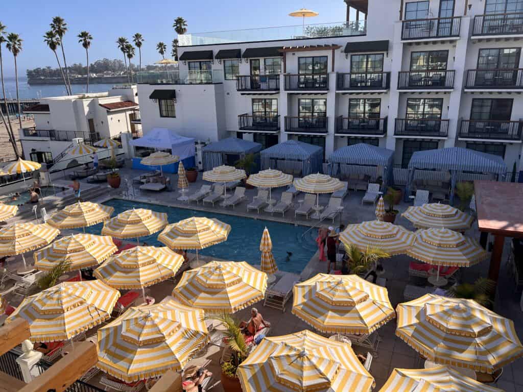 La Bahia Hotel Santa Cruz pool with yellow striped umbrellas