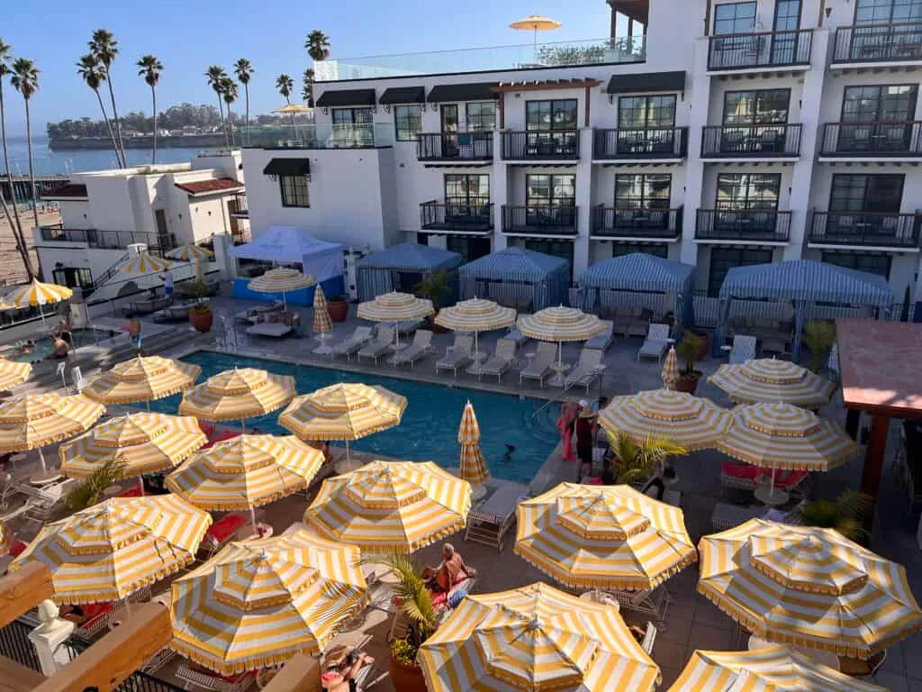 La Bahia Hotel Santa Cruz Review: Is Santa Cruz's New Luxury Hotel Worth the Splurge? 29 La Bahia Hotel Santa Cruz pool with yellow striped umbrellas