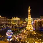 Stunning nighttime aerial view of the Las Vegas Strip featuring the Eiffel Tower replica.