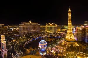 Stylish and Sparkly Las Vegas Sights Worth Visiting 3 Stunning nighttime aerial view of the Las Vegas Strip featuring the Eiffel Tower replica.