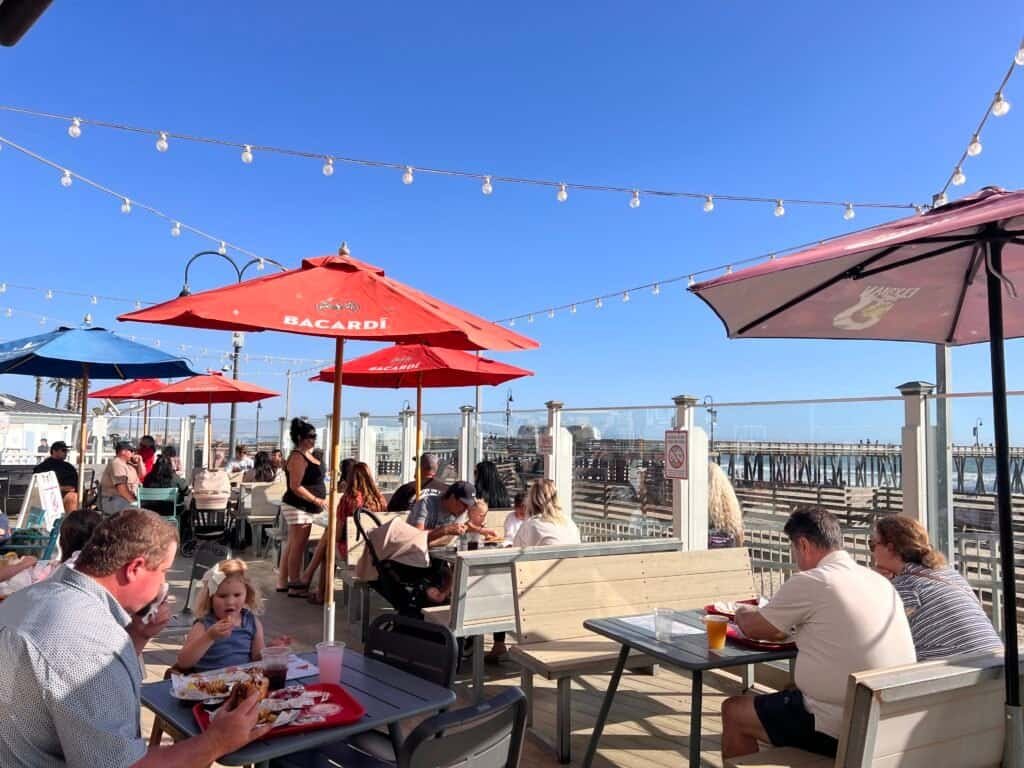 Pacific Point Resort Pismo Beach Review: What It’s Really Like to Stay (With My Dog) 18 Late afternoon light on the deck at Wooly's restaurant in Pismo Beach