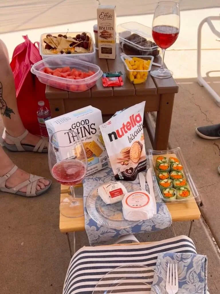 Charcuterie spread with cheeses, salami, and crackers laid out in the cabana